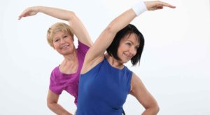 Two older women exercising