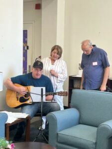 A guitarist performs at the open house event