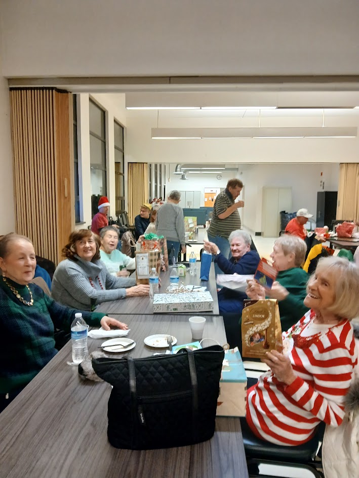 A room full of seniors having a great time at the party