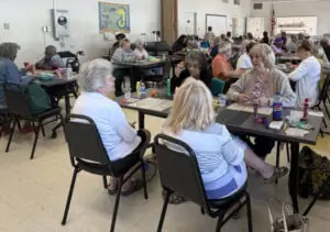 Older adults having lunch in the great room
